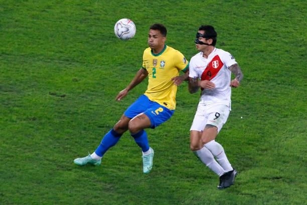 Danilo da Silva of Brazil competes for the ball with Gianluca Lapadula of Peru during a semi-final match of Copa America Brazil 2021 between Brazil...