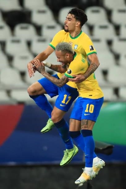 Lucas Paqueta of Brazil celebrates with teammate Neymar Jr. After scoring the first goal of his team during a semi-final match of Copa America Brazil...