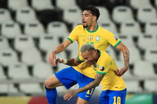 Lucas Paqueta of Brazil celebrates with teammate Neymar Jr. After scoring the first goal of his team during a semi-final match of Copa America Brazil...