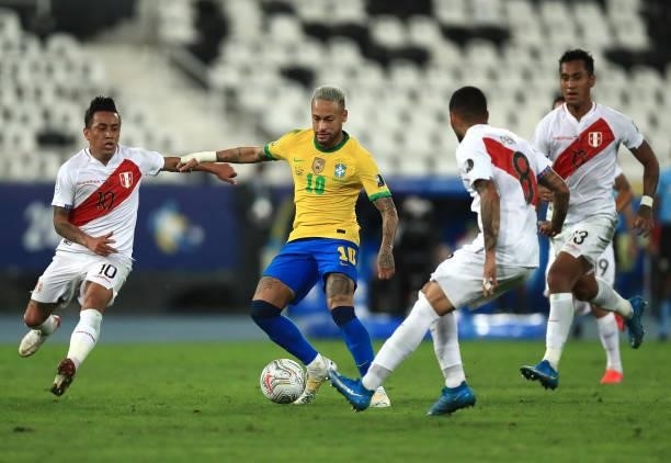 Neymar Jr. Of Brazil competes for the ball with Christian Cueva and Sergio Peña of Peru during a semi-final match of Copa America Brazil 2021 between...