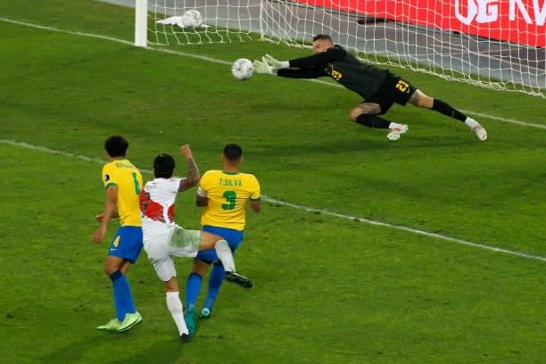 Ederson goalkeeper of Brazil makes a save against a kick from Gianluca Lapadula of Peru during a semi-final match of Copa America Brazil 2021 between...