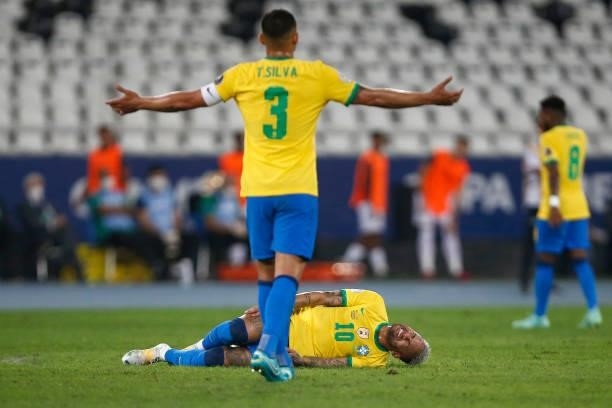 Neymar Jr. Of Brazil reacts after being injured as teammate Thiago Silva gestures during a semi-final match of Copa America Brazil 2021 between...
