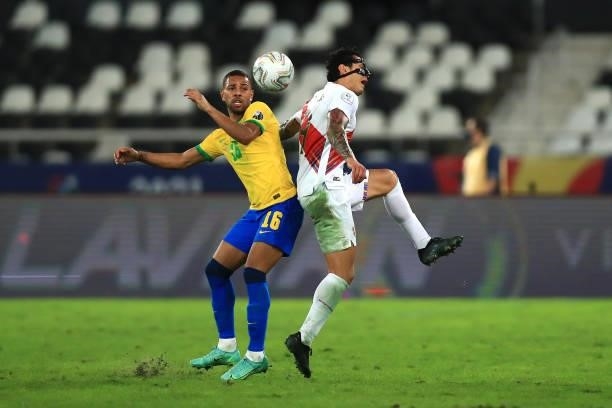 Renan Lodi of Brazil competes for the ball with Gianluca Lapadula of Peru during a semi-final match of Copa America Brazil 2021 between Brazil and...