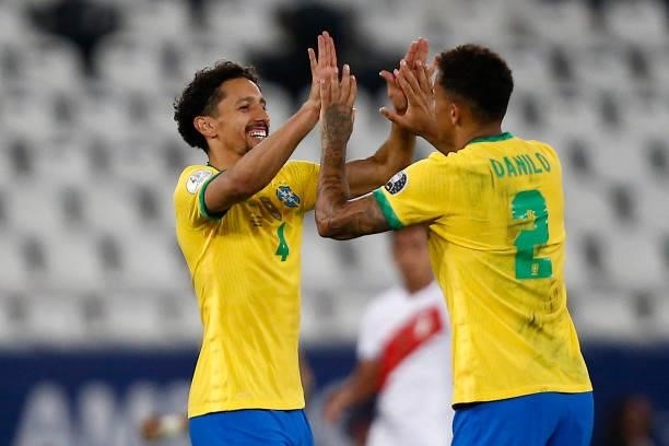 Danilo da Silva of Brazil celebrates with teammate Marquinhos after winning a semi-final match of Copa America Brazil 2021 between Brazil and Peru at...