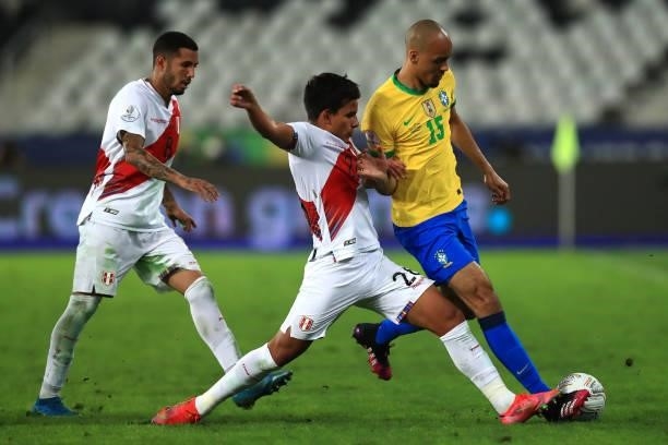 Fabinho of Brazil competes for the ball with Carlos Lora of Peru during a semi-final match of Copa America Brazil 2021 between Brazil and Peru at...