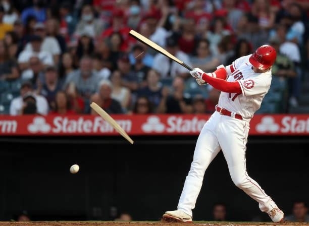 Shohei Ohtani of the Los Angeles Angels breaks his bat on a fielder's choice against the Boston Red Sox in the third inning at Angel Stadium of...