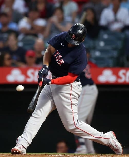 Rafael Devers of the Boston Red Sox hits a two-run home run against the Los Angeles Angels in the fourth inning at Angel Stadium of Anaheim on July...