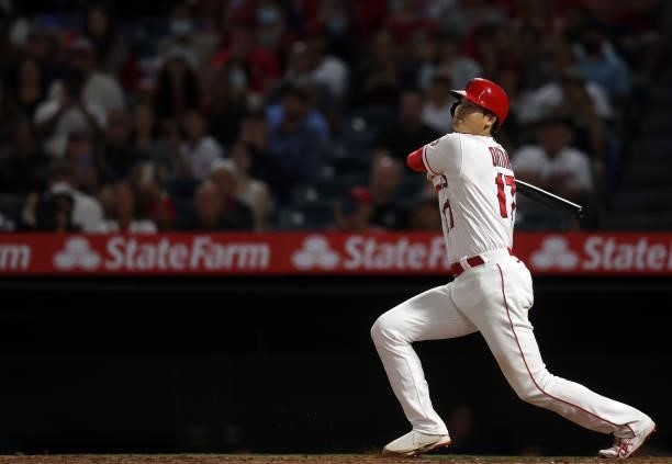 Shohei Ohtani of the Los Angeles Angels hits a single against the Boston Red Sox in the fifth inning at Angel Stadium of Anaheim on July 05, 2021 in...
