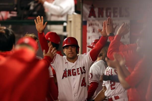 Jose Iglesias of the Los Angeles Angels celebrates a run against the Boston Red Sox in the ninth inning at Angel Stadium of Anaheim on July 05, 2021...
