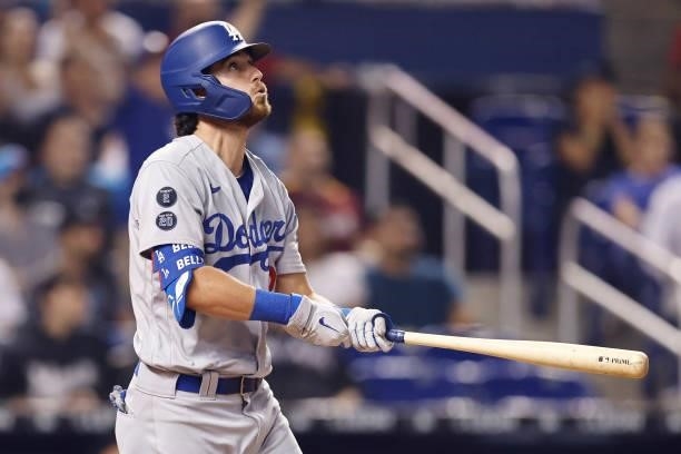 Cody Bellinger of the Los Angeles Dodgers hits a RBI sacrifice fly during the eighth inning against the Miami Marlins at loanDepot park on July 05,...