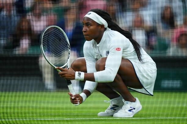 Coco Gauff of The United States, playing partner of Caty McNally of The United States crouches at the net in their Ladies' Doubles Third Round match...