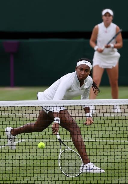 Coco Gauff of The United States, playing partner of Caty McNally of The United States plays a backhand at the net in their Ladies' Doubles Third...