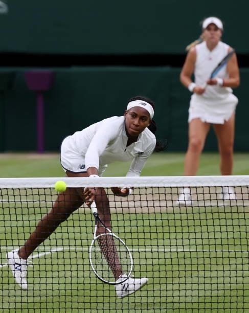 Coco Gauff of The United States, playing partner of Caty McNally of The United States plays a backhand at the net in their Ladies' Doubles Third...