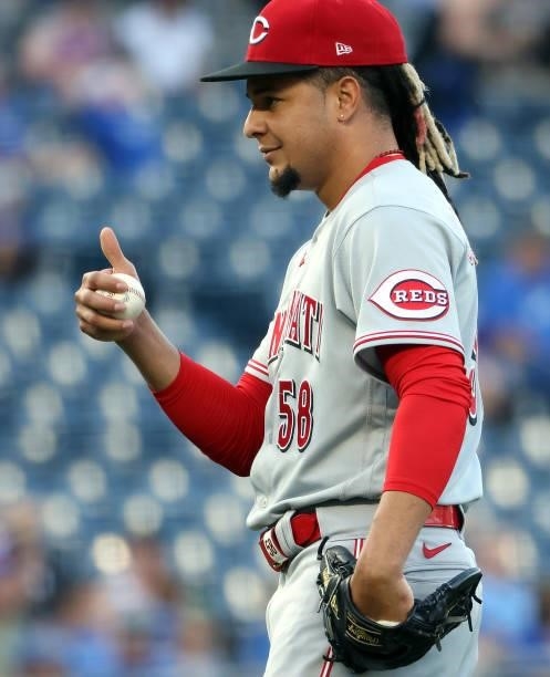 Starting pitcher Luis Castillo of the Cincinnati Reds reacts after catching a line drive for the second out during the 1st inning of the game against...