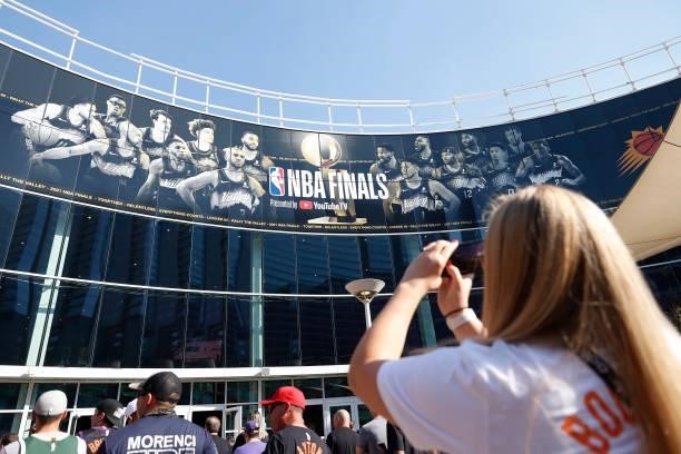 Phoenix Suns fan ltakes a photo of the exterior NBA Finals signage before Game One of the NBA Finals between the Milwaukee Bucks and the Phoenix Suns...