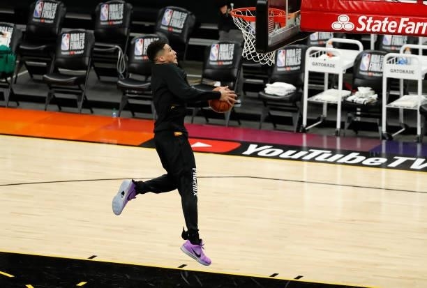 Devin Booker of the Phoenix Suns warms up before Game One of the NBA Finals against the Milwaukee Bucks at Phoenix Suns Arena on July 06, 2021 in...