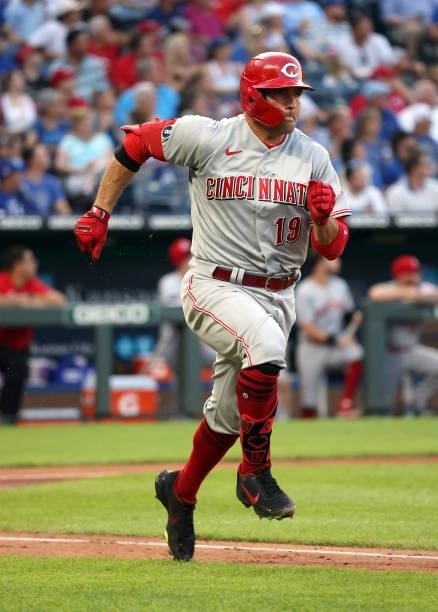 Joey Votto of the Cincinnati Reds sprints up the first base line for a 2-RBI triple during the 3rd inning of the game against the Kansas City Royals...