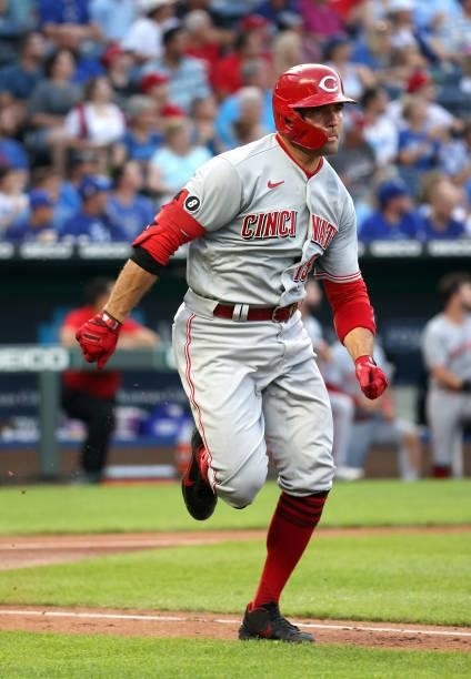 Joey Votto of the Cincinnati Reds sprints up the first base line for a 2-RBI triple during the 3rd inning of the game against the Kansas City Royals...