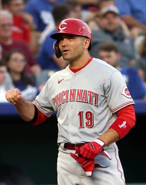 Joey Votto of the Cincinnati Reds reacts after hitting a 2-RBI triple during the 3rd inning of the game against the Kansas City Royals at Kauffman...