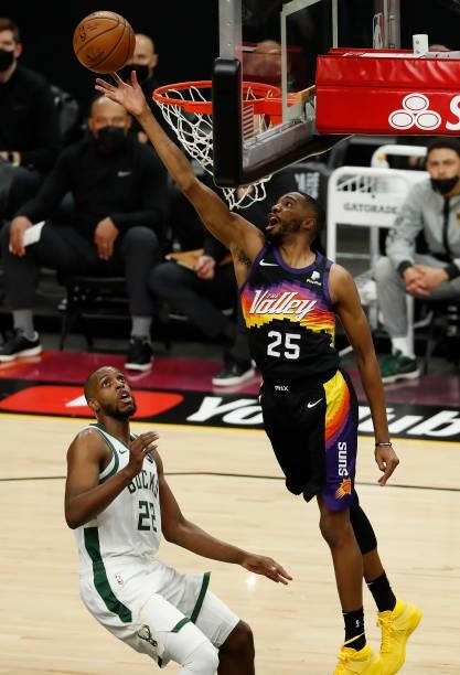 Mikal Bridges of the Phoenix Suns goes up for a shot against Khris Middleton of the Milwaukee Bucks during the first quarter in Game One of the NBA...