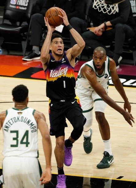 Devin Booker of the Phoenix Suns goes up for a shot against the Milwaukee Bucks during the first quarter in Game One of the NBA Finals at Phoenix...