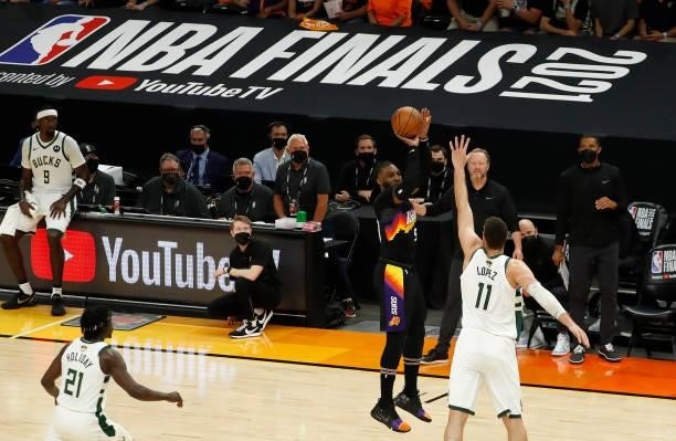 Jae Crowder of the Phoenix Suns shoots against Brook Lopez of the Milwaukee Bucks during the first quarter in Game One of the NBA Finals at Phoenix...