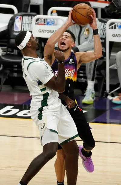 Devin Booker of the Phoenix Suns goes up for a shot against Bobby Portis of the Milwaukee Bucks during the first quarter in Game One of the NBA...