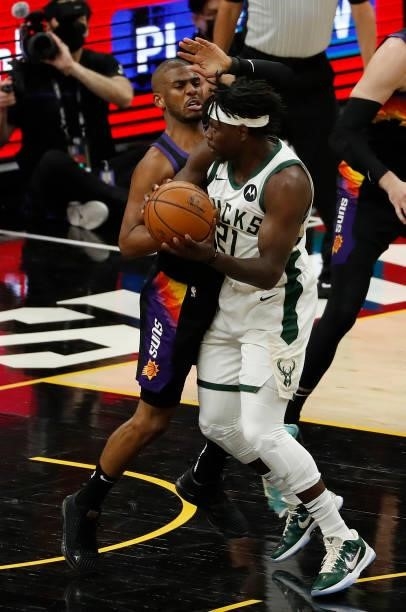 Chris Paul of the Phoenix Suns defends against Jrue Holiday of the Milwaukee Bucks during the first half in Game One of the NBA Finals at Phoenix...