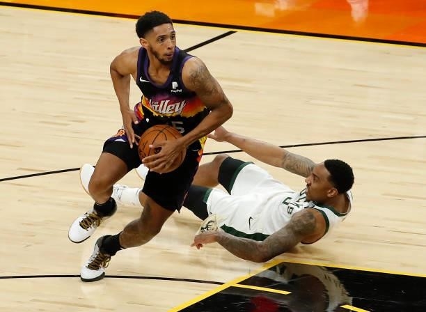Cameron Payne of the Phoenix Suns drives to the basket against Jeff Teague of the Milwaukee Bucks during the first half in Game One of the NBA Finals...