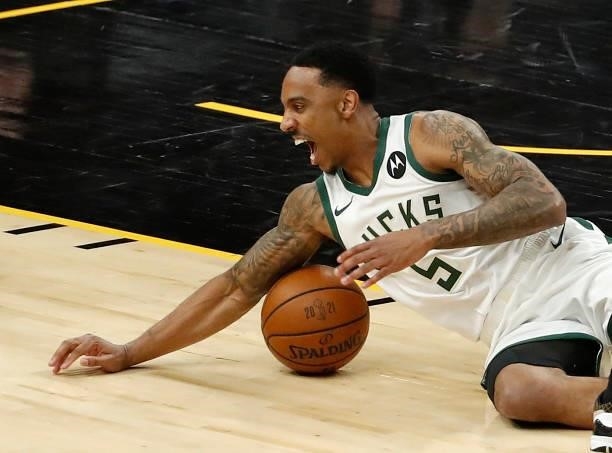 Jeff Teague of the Milwaukee Bucks falls on the ball during the first half in Game One of the NBA Finals against the Phoenix Suns at Phoenix Suns...