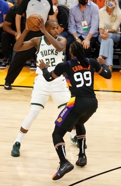 Khris Middleton of the Milwaukee Bucks is defended by Jae Crowder of the Phoenix Suns during the first half in Game One of the NBA Finals at Phoenix...
