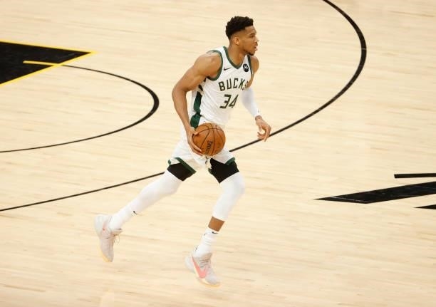 Giannis Antetokounmpo of the Milwaukee Bucks brings the ball up court against the Phoenix Suns during the first half in Game One of the NBA Finals at...