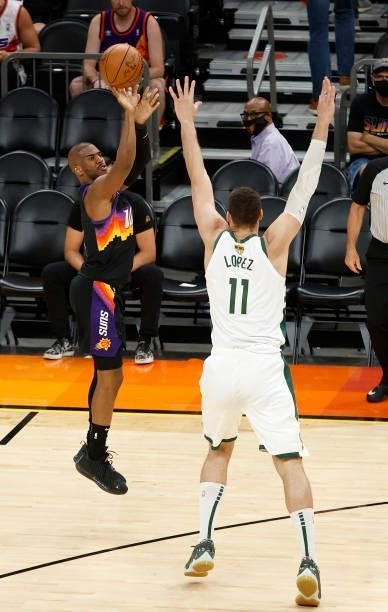 Chris Paul of the Phoenix Suns shoots against Brook Lopez of the Milwaukee Bucks during the second half in Game One of the NBA Finals at Phoenix Suns...