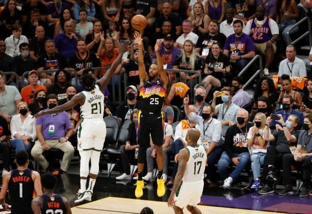 Mikal Bridges of the Phoenix Suns shoots against Jrue Holiday of the Milwaukee Bucks during the first half in Game One of the NBA Finals at Phoenix...
