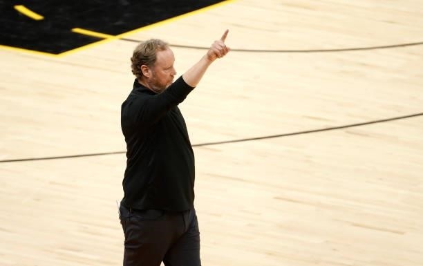 Head coach Mike Budenholzer of the Milwaukee Bucks signals against the Phoenix Suns during the first half in Game One of the NBA Finals at Phoenix...