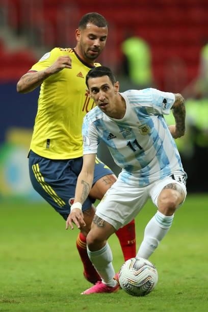 Edwin Cardona of Colombia competes for the ball with Angel Di Maria of Argentina during a semi-final match of Copa America Brazil 2021 between...