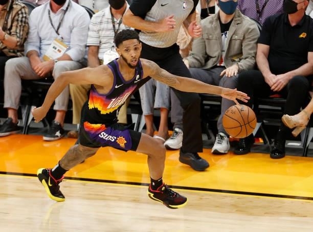 Cameron Payne of the Phoenix Suns brings the ball up court against the Milwaukee Bucks during the second half in Game One of the NBA Finals at...