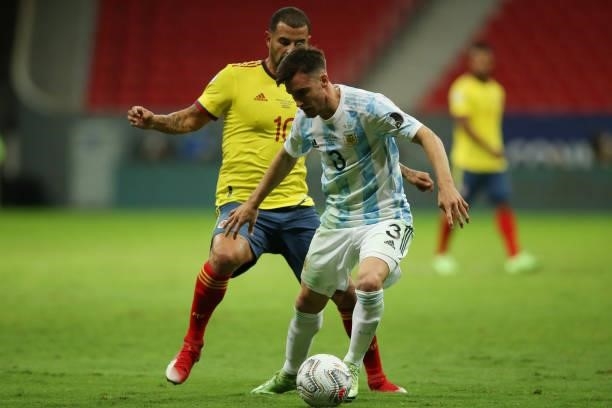Edwin Cardona of Colombia competes for the ball with Nicolas Tagliafico of Argentina during a semi-final match of Copa America Brazil 2021 between...
