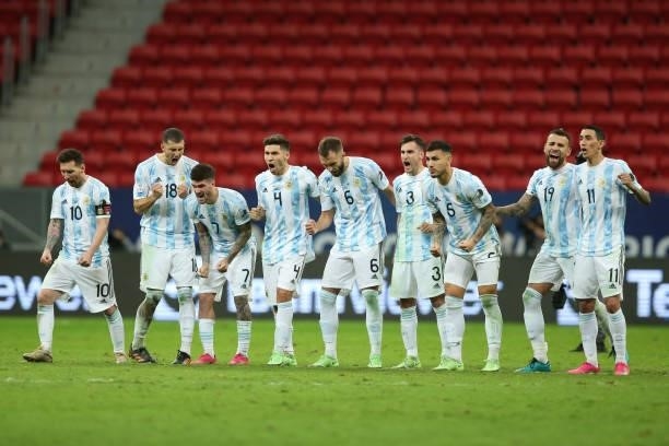 Players of Argentina celebrate during a penalty shootout after a semi-final match of Copa America Brazil 2021 between Argentina and Colombia at Mane...