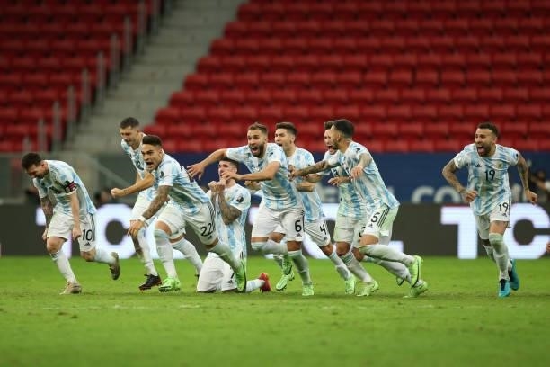 Lionel Messi and Lautaro Martinez of Argentina celebrate with teammates winning a penalty shootout after a semi-final match of Copa America Brazil...