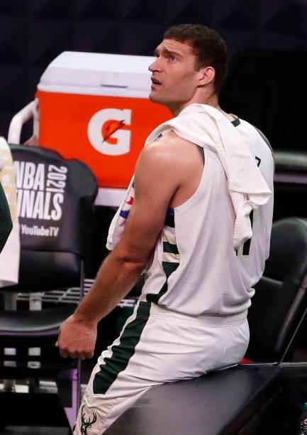 Brook Lopez of the Milwaukee Bucks looks on from the bench during the first half in Game One of the NBA Finals against the Phoenix Suns at Phoenix...