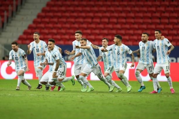 Lionel Messi of Argentina celebrates with teammates winning a penalty shootout after a semi-final match of Copa America Brazil 2021 between Argentina...