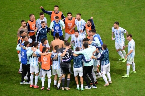 Lionel Messi of Argentina celebrates with teammates winning a penalty shootout after a semi-final match of Copa America Brazil 2021 between Argentina...