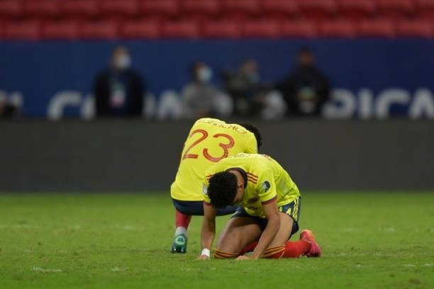 Davinson Sanchez and Luis Diaz of Colombia react after losing a penalty shootout after a semi-final match of Copa America Brazil 2021 between...