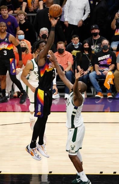 Deandre Ayton of the Phoenix Suns shoot against Khris Middleton of the Milwaukee Bucks during the second half in Game One of the NBA Finals at...