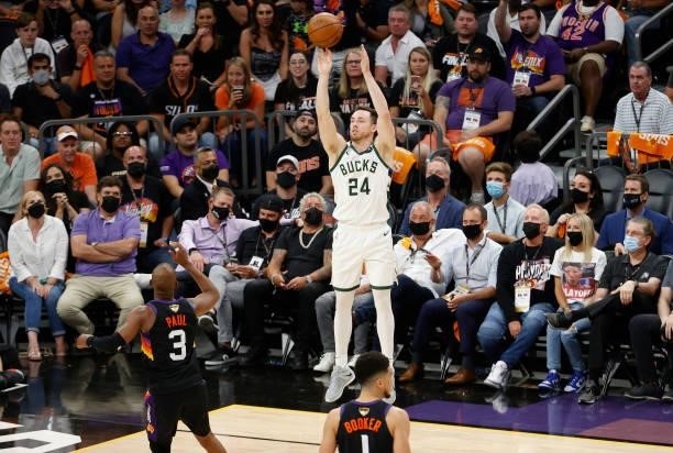 Pat Connaughton of the Milwaukee Bucks shoots against the Phoenix Suns during the second half in Game One of the NBA Finals at Phoenix Suns Arena on...