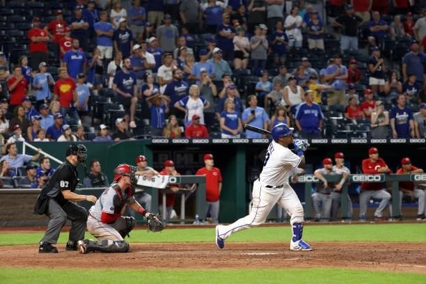 Salvador Perez of the Kansas City Royals rhits the game-winning walk-off single to defeat the Cincinnati Reds 7-6 and win the game in the bottom of...