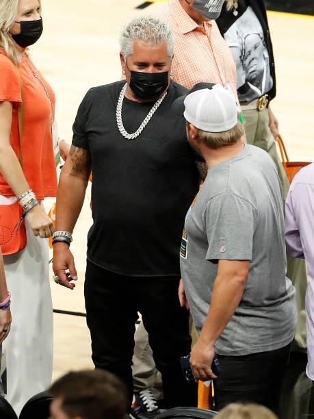 Guy Fieri shakes hands with fans in Game One of the NBA Finals between the Milwaukee Bucks and the Phoenix Suns at Phoenix Suns Arena on July 06,...