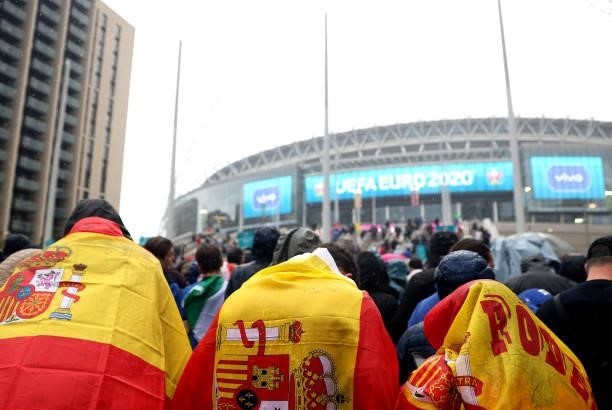 Spain fans make their way to the stadium during the UEFA Euro 2020 Championship Semi-final match between Italy and Spain at Wembley Stadium on July...