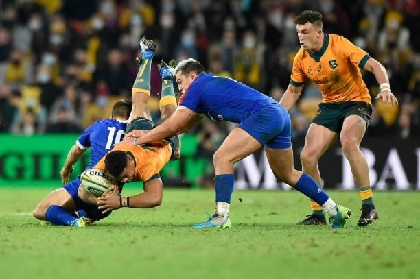 Hunter Paisami of the Wallabies is tackled during the international Test match between the Australia Wallabies and France at Suncorp Stadium on July...